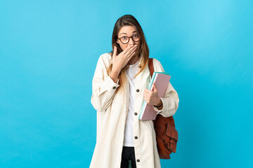 Young Ireland student woman over isolated background happy and smiling covering mouth with hand