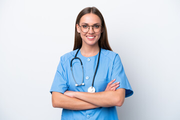 Young nurse caucasian woman isolated on white background keeping the arms crossed in frontal...