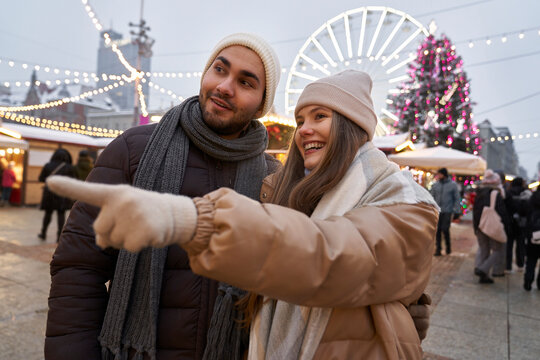 Caucasian couple having fun on Christmas market