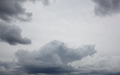 Dramatic dark clouds before rainy. Beautiful cloudscape over horizon, sky