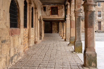 Streets of the beautiful village of Medinacelli at sunset with a incredible sky. Soria, Castilla y Leon, Spain.