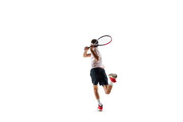 Dynamic image of young sportive man in sportswear practicing tennis, running with racket isolated over white background. Concept of sport, hobby, active and healthy lifestyle, competition