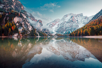 Great view of the mighty rock above peaceful alpine lake Braies. National park Fanes-Sennes-Braies, Italy, Europe.