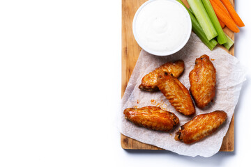 Buffalo spicy chicken wings with cayenne pepper sauce isolated on white background. Top view. Copy...