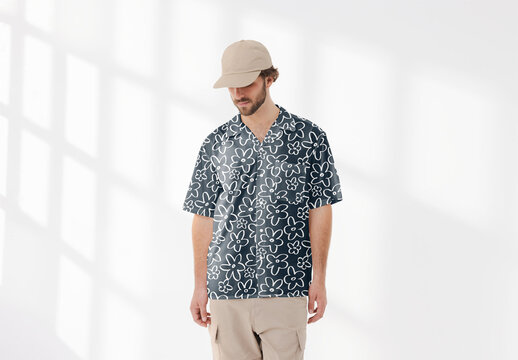 Mockup of man wearing customizable patterned shirt and cap