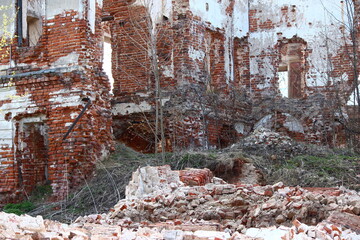 Collapsed outer wall of an old abandoned brick house. Belkino Estate, Russia