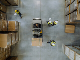 Top view of forklift in a modern warehouse storage of retail shop, large factory workshop space....