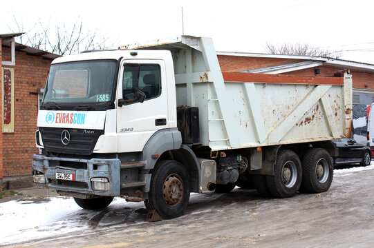 Vinnytsia, Ukraine; December 05, 2023. White Mercedes Axor 3340
Dump truck standing at the parking. Mercedes Axor at the city street.