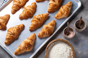 Container with croissants in the kitchen