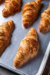 Container with croissants in the kitchen
