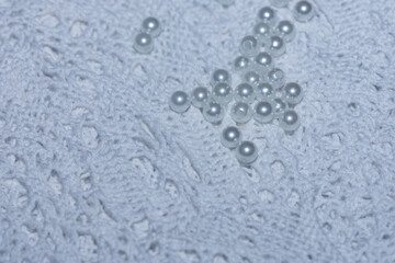 white beads clseup on lace  openwrk.