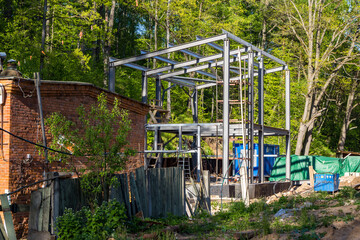 Construction site for the construction of a new sewage pumping station building in the forest,...