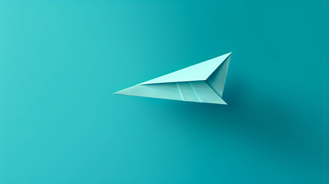 Paper airplane on blue green background