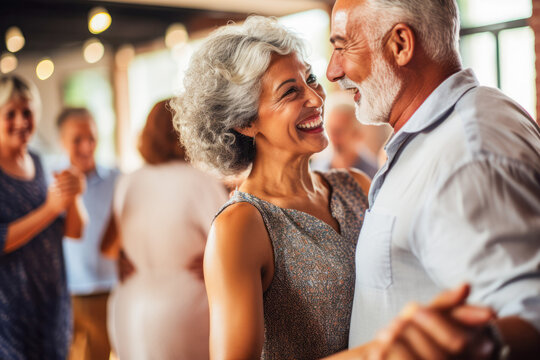 Elderly couple in the dancing class, healthy senior years. Learning how to dance, recreation for couple, spending quality time together.