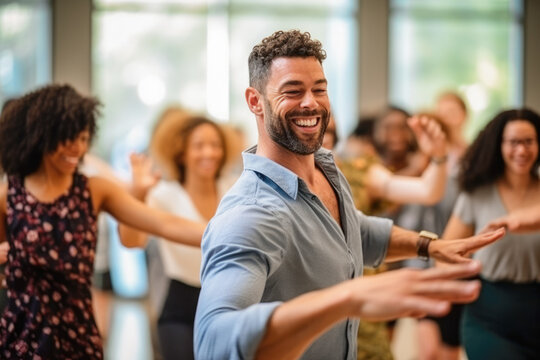 Dancing classes for single adults, handsome male teacher demonstrating how to dance salsa. Recreation for adults, healthy lifestyle.
