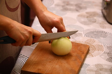 Obraz na płótnie Canvas Cutting onion