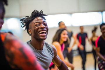 Gordijnen Afro american man is dancing in studio, hip-hop dancers at practice, smiling, singing. Free dance workshops for children from poor families. © VisualProduction