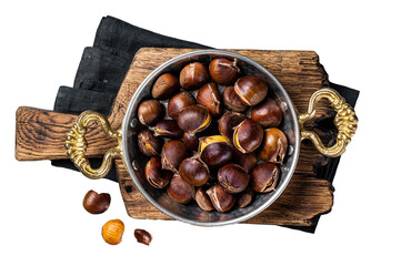 Cracked roasted chestnuts served in a skillet.  Transparent background. Isolated.
