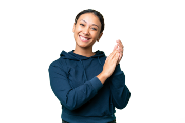 Young Uruguayan woman over isolated chroma key background applauding
