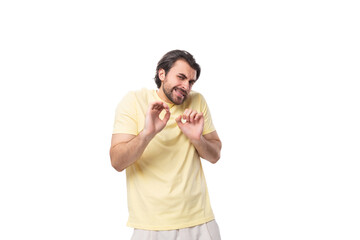 well-groomed young caucasian man with unshaven beard and mustache feels excited