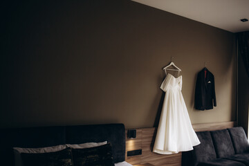 bride's dress and groom's suit at the hotel