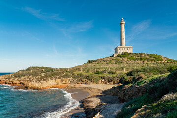 Cabo de Palos Lighthouse, situated in Cape Palos, La Manga del Mar Menor, Murcia, Spain. The lighthouse was been in operation since 1865. CAn be visited and offer spectacular view of all region. - obrazy, fototapety, plakaty