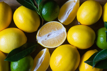 Ripe lemons, limes, calendar for the new year 2024 on a dark background.