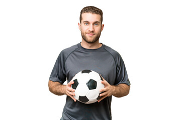 Young handsome blonde man over isolated chroma key background with soccer ball
