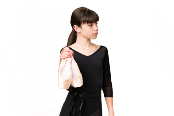 Little caucasian girl practicing ballet over isolated background looking to the side
