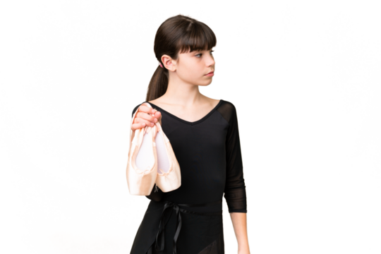 Little caucasian girl practicing ballet over isolated background looking to the side