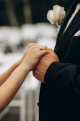 Picture of man and woman with wedding ring.Young married couple holding hands, ceremony wedding...
