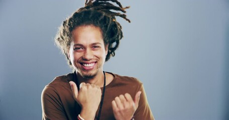 Happiness, music and face of man dancing, smile and having fun, groovy and celebrate at Jamaica party event. Portrait, energy and dancer celebration, rhythm or moving to radio on grey background