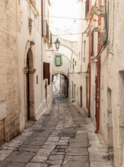 Ostuni, Italy - one of the most beautiful villages in South Italy, Ostuni displays a wonderful Old Town with narrow streets and alleys  - obrazy, fototapety, plakaty