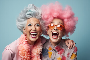Two funny ladies with colorful hairstyles on a blue background.