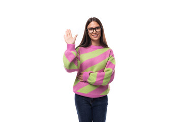 pretty 35 year old feminine model woman dressed in a striped pink-green sweater on a white background
