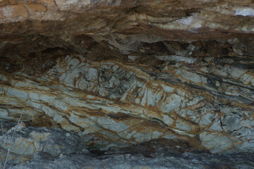 Coloured rock patterns in the back of the cave.