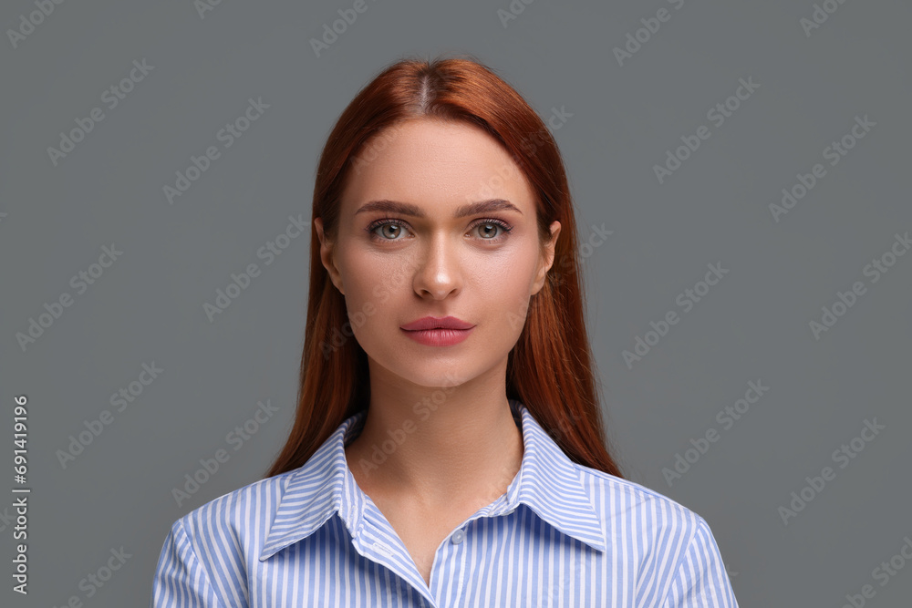 Canvas Prints Portrait of beautiful young woman on grey background