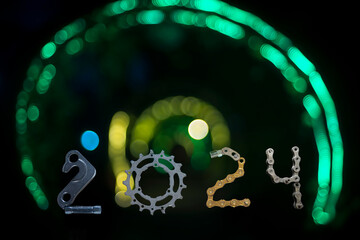 2024 concept number from bicycles part on blur bokeh light background
