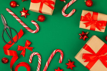 Candy cane.Christmas candy canes on a green background. Holiday greeting card. Concept for Christmas and New Year holidays. Winter. Flatlay, top view, copy space.