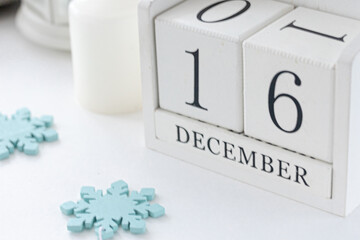 White block calendar presents date 16 and month December, website events.  Winter decoration concept. Winter days.