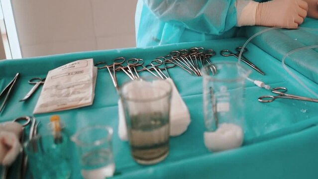 Doctors in a medical clinic perform a medical operation on a patient, operating room with instruments and medicines. Treating epidemics and diseases