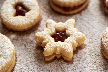 Linzer Christmas cookie in the shape of a star, filled with strawberry marmalade