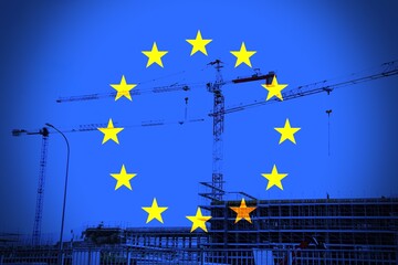 European flag with building construction as a background.