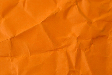 A sheet of crumpled orange paper