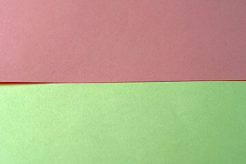 Fototapeta premium Sheets of red and yellow paper lie on the table