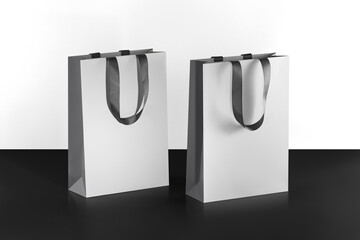 Mockup of a white paper bag with gray fabric handles