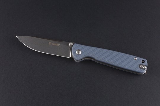 LVIV, UKRAINE - December 08, 2023: Folding knife Ganzo G6805