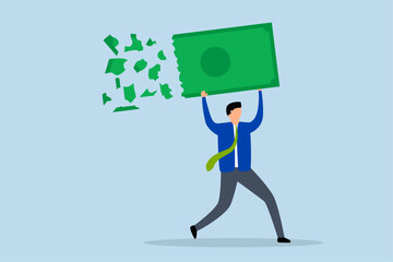 Lose money investment in financial crisis, Businessman holding large dollar banknote money as it deteriorates, crumbles, and loses value.