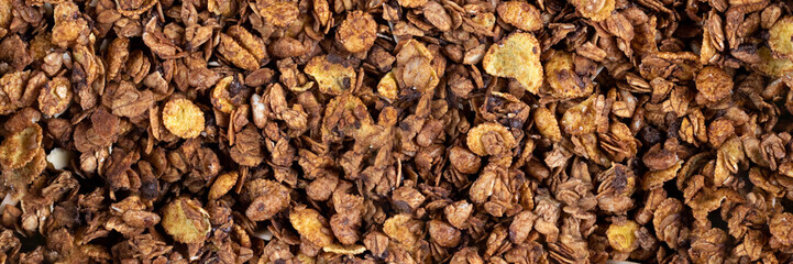 Organic roasted granola cereal banner. Top view muesli background texture panoramic web header. Wide screen wallpaper