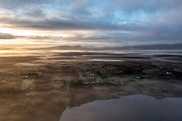 Fototapeta na wymiar Aerial view of Lough fad in the morning fog, County Donegal, Republic of Ireland